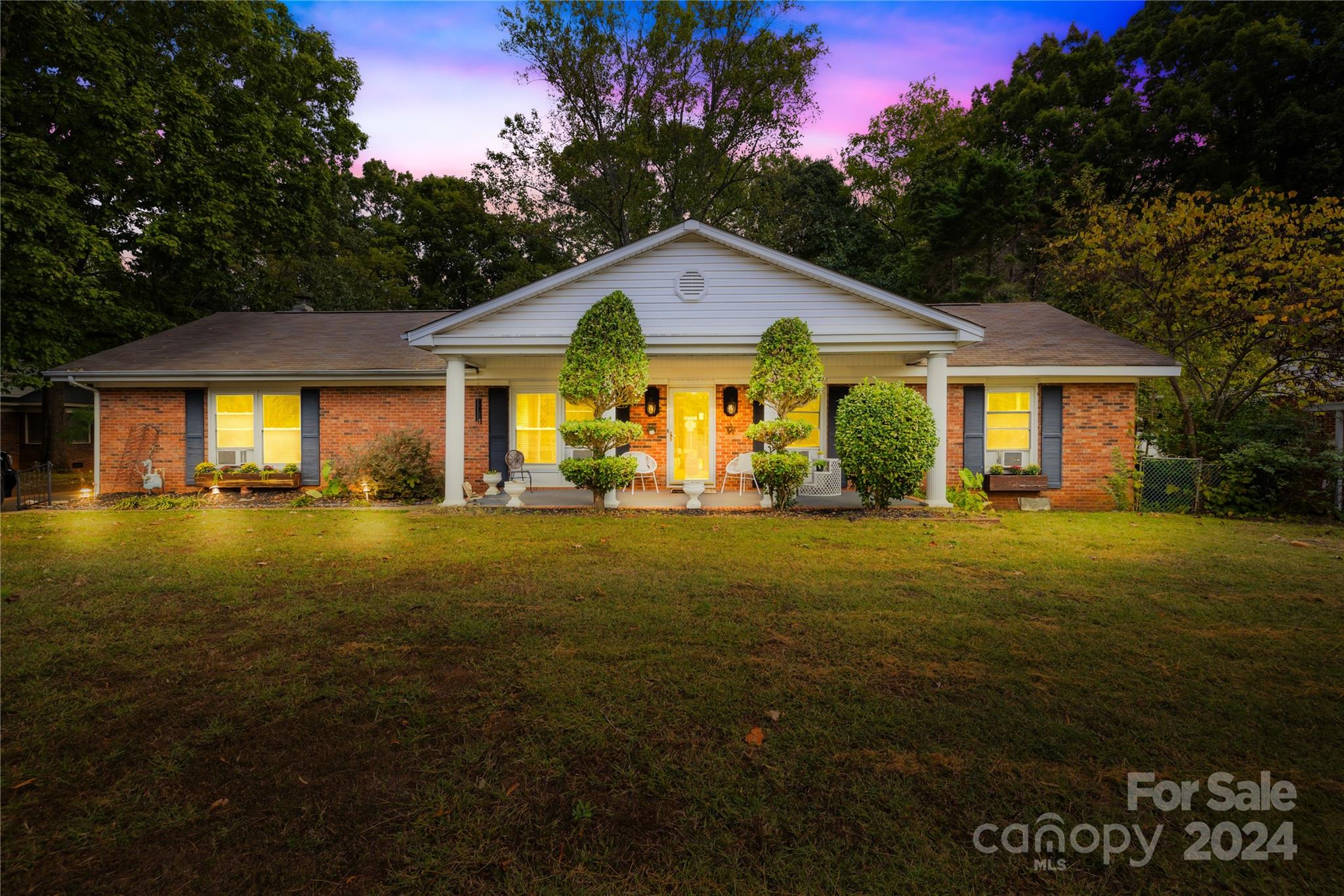 a front view of a house with yard