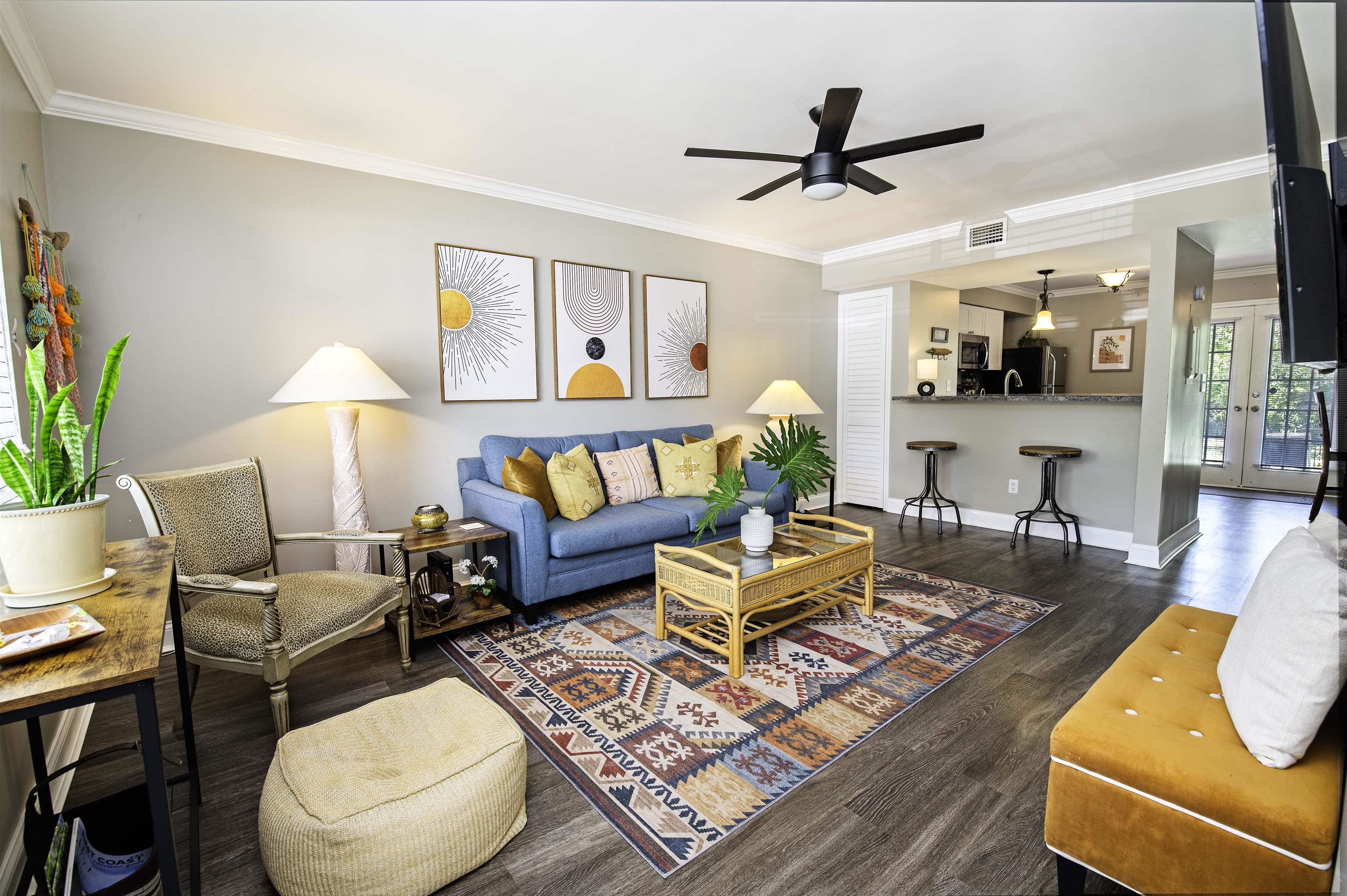 a living room with furniture and a rug