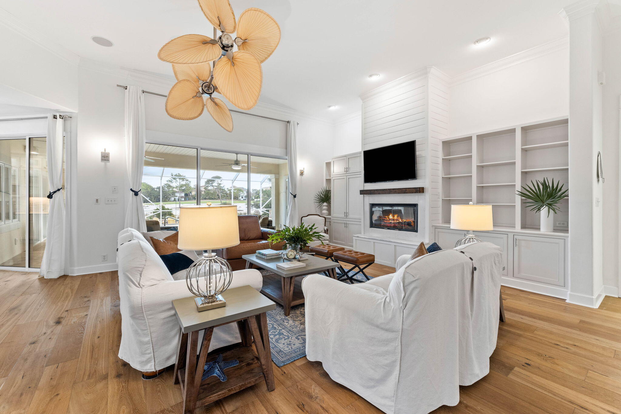 a living room with fireplace furniture and a flat screen tv