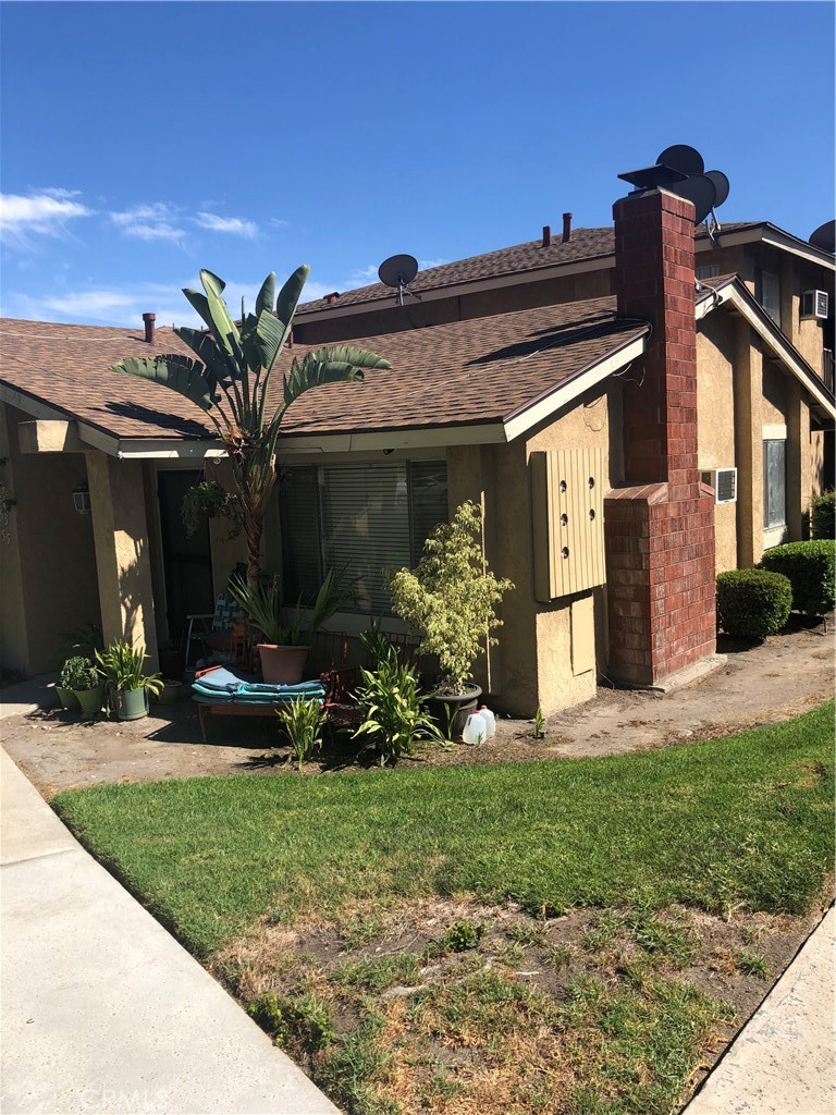 front view of a house with a yard