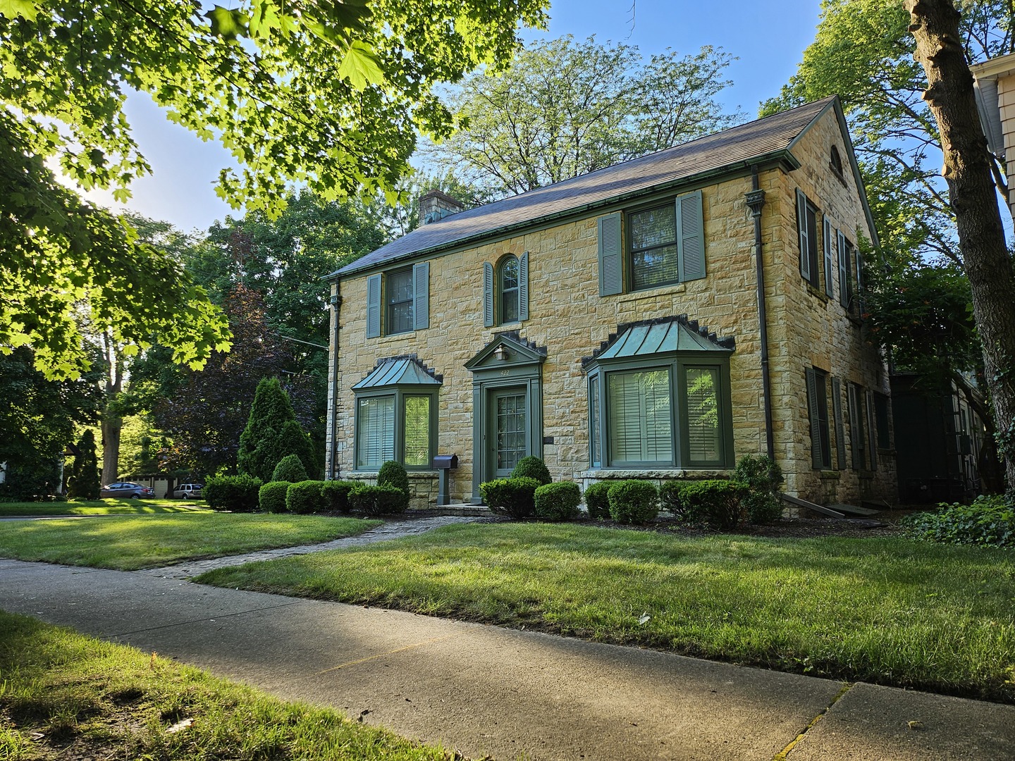 a front view of a house with garden