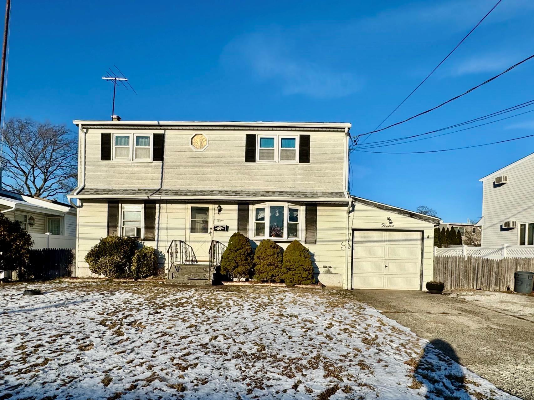 View of front of property featuring a garage