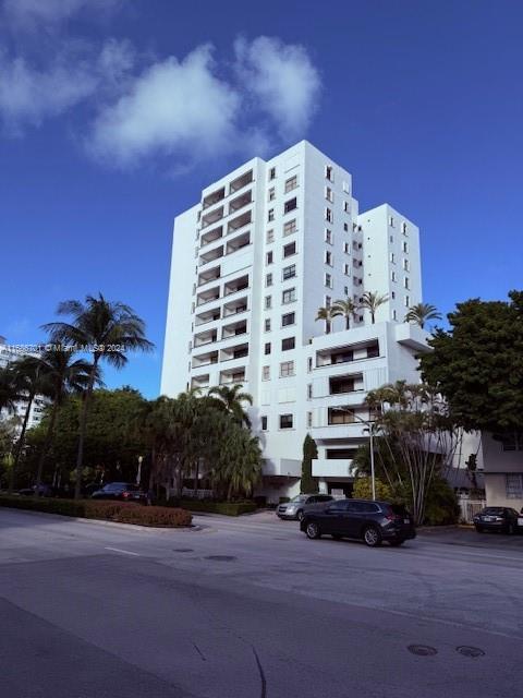 a tall building sitting next to a road