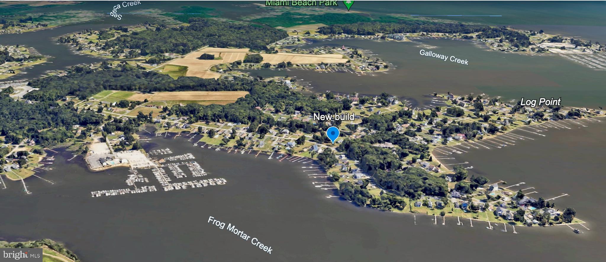 an aerial view of a houses with ocean view