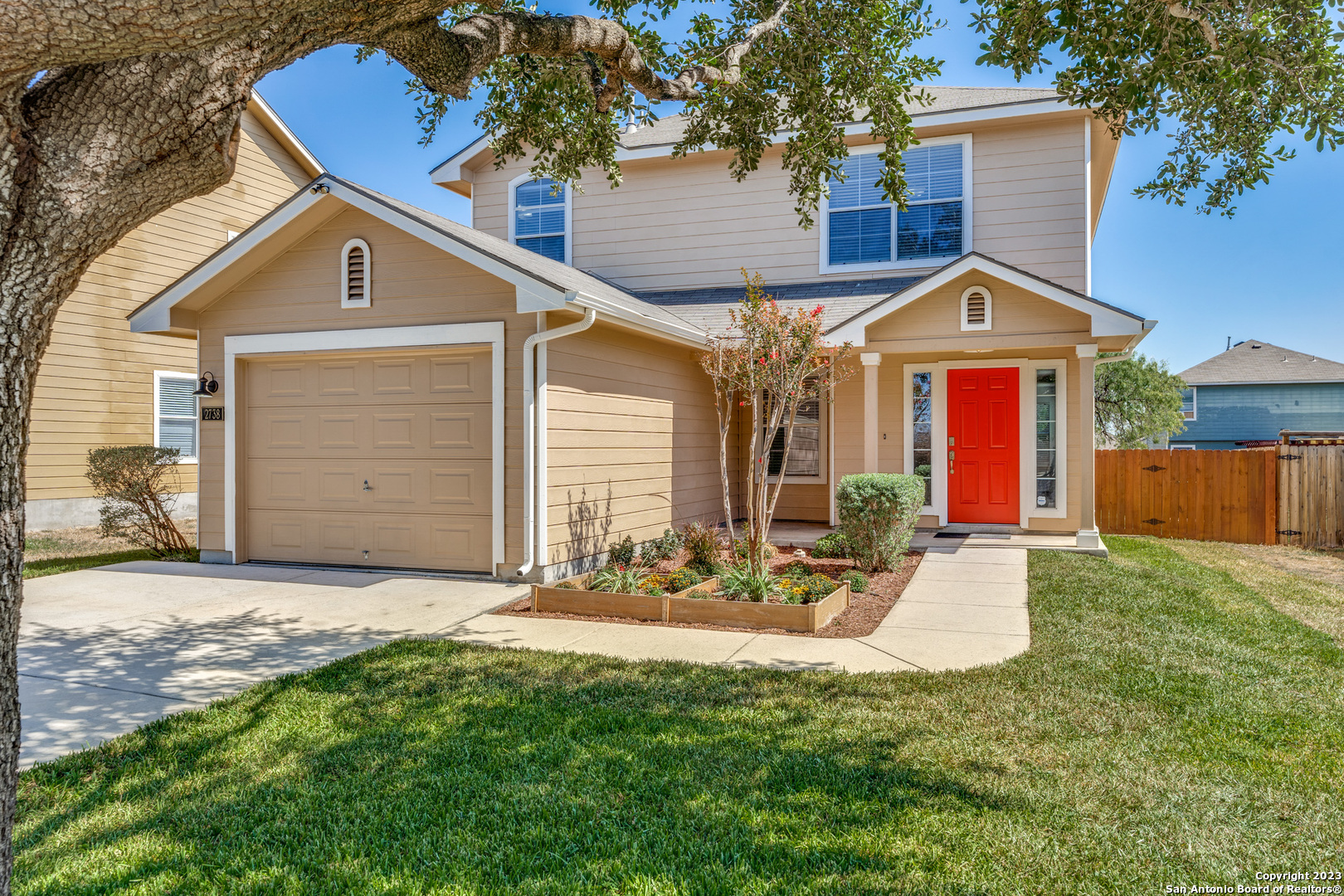 a view of a house with a yard patio and fire pit