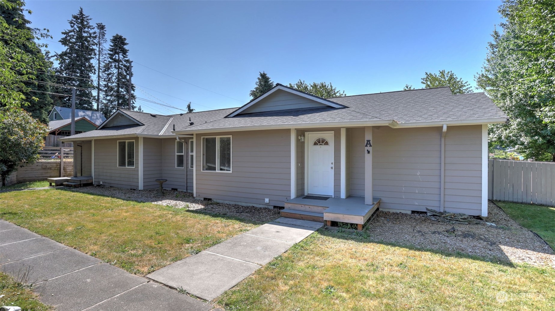 a view of a house with a yard