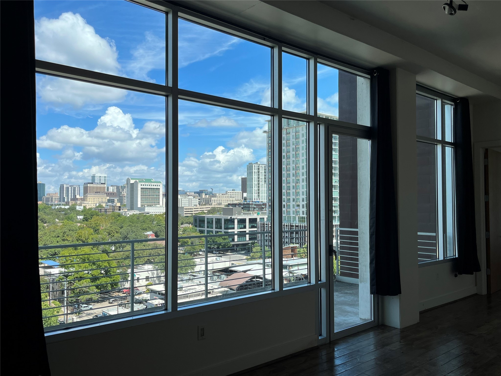 a view of a glass door and wooden floor