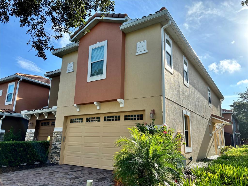 a view of a house with a garage