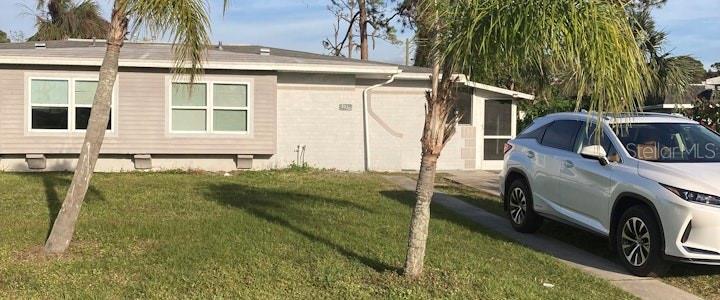 a view of a house with backyard