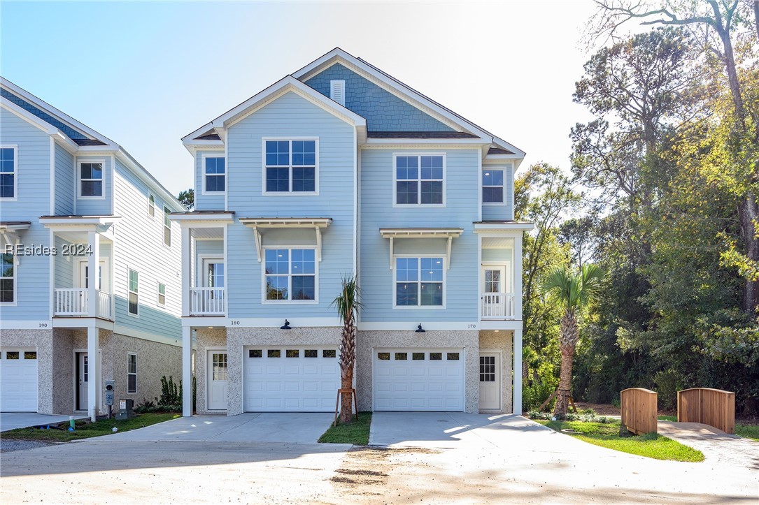 View of front of property featuring a garage