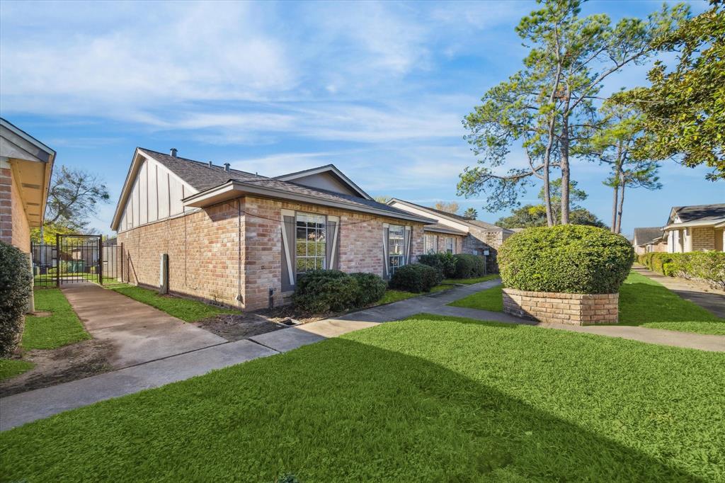 a view of a house with a yard and plants