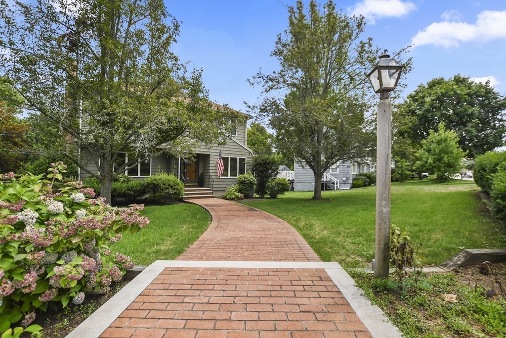 a front view of a house with garden