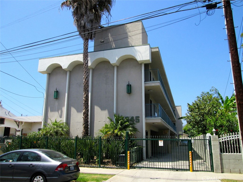 a view of a car parked in front of a building