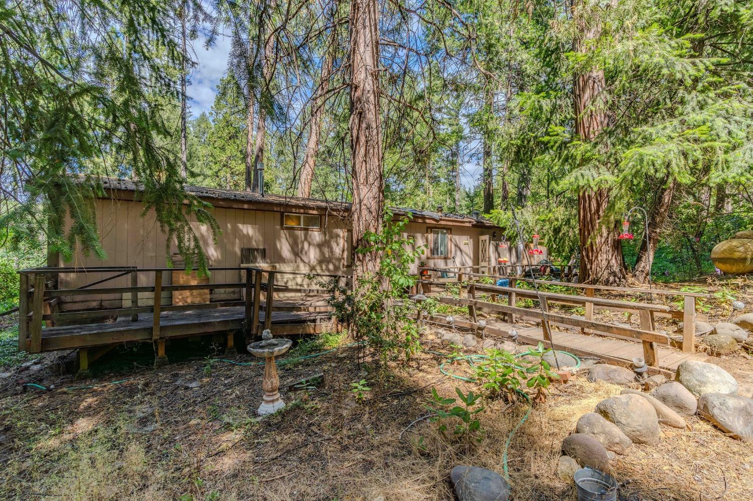 a view of a house with a backyard