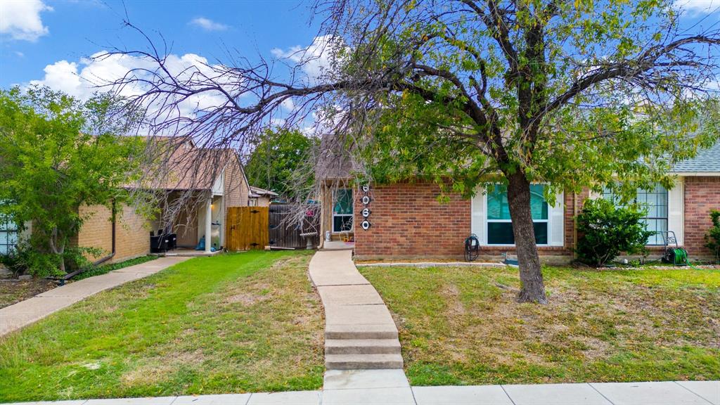 front view of a house with a yard