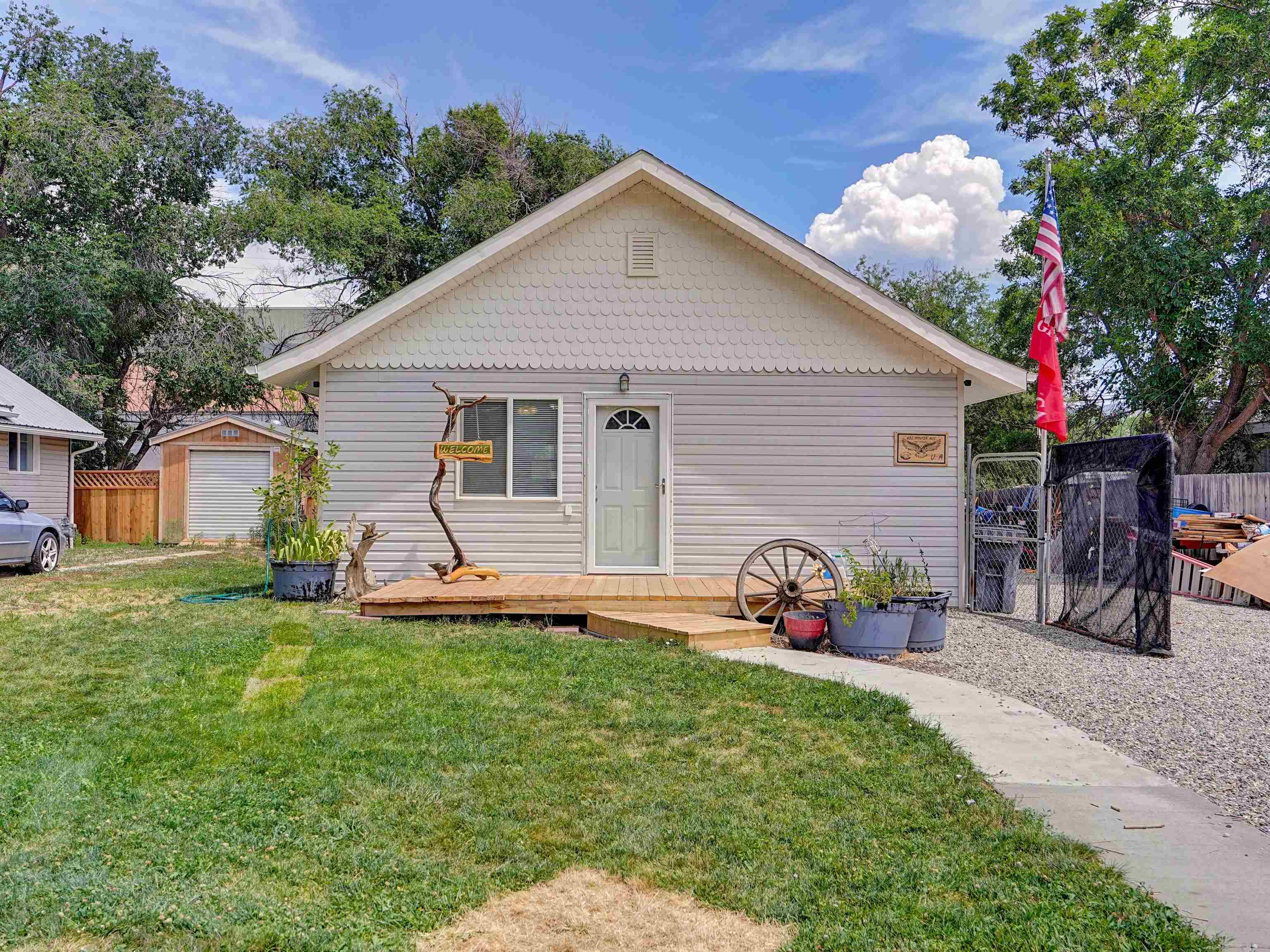 a front view of house with yard and seating area