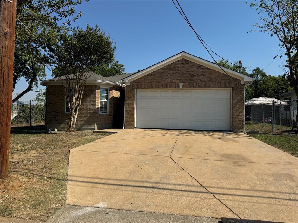 a view of house and garage