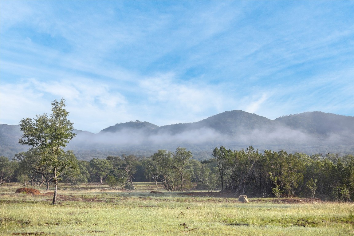 a view of a town with mountains in the background