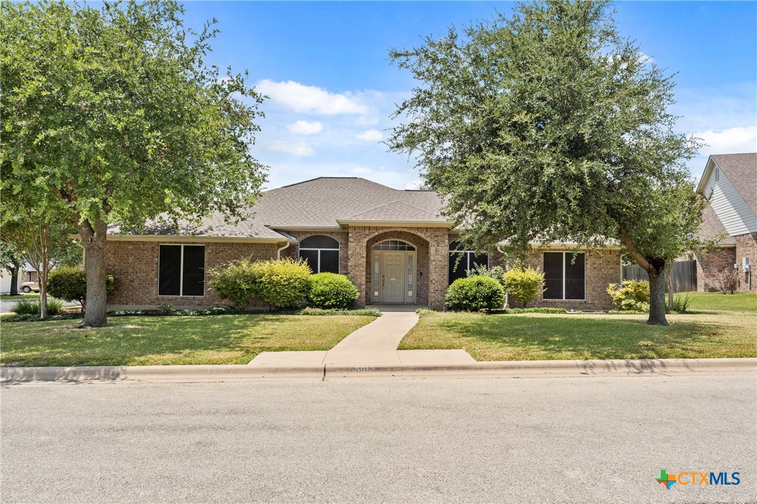 front view of a house with a yard