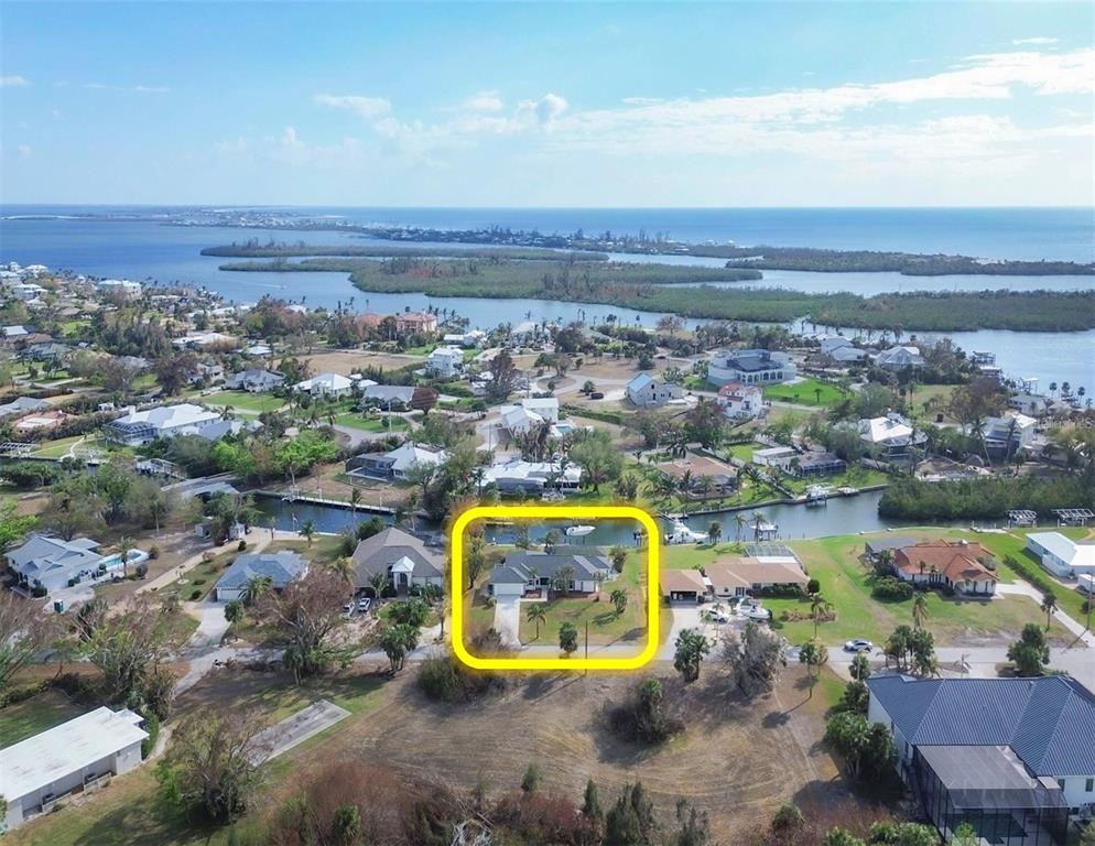 an aerial view of a swimming pool and lake view