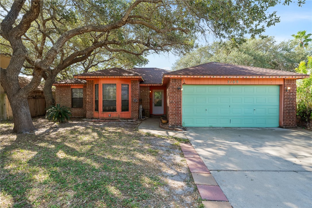 a front view of a house with a garage