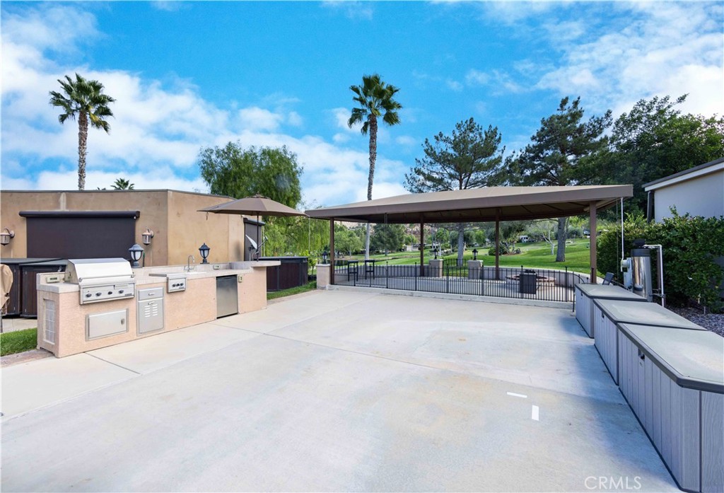 a view of a swimming pool with a patio