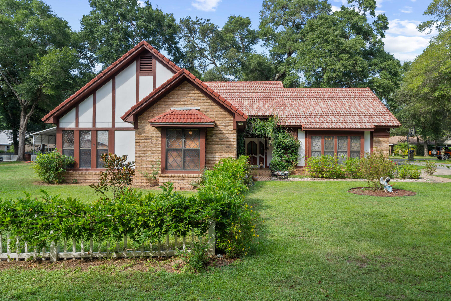 a front view of a house with garden