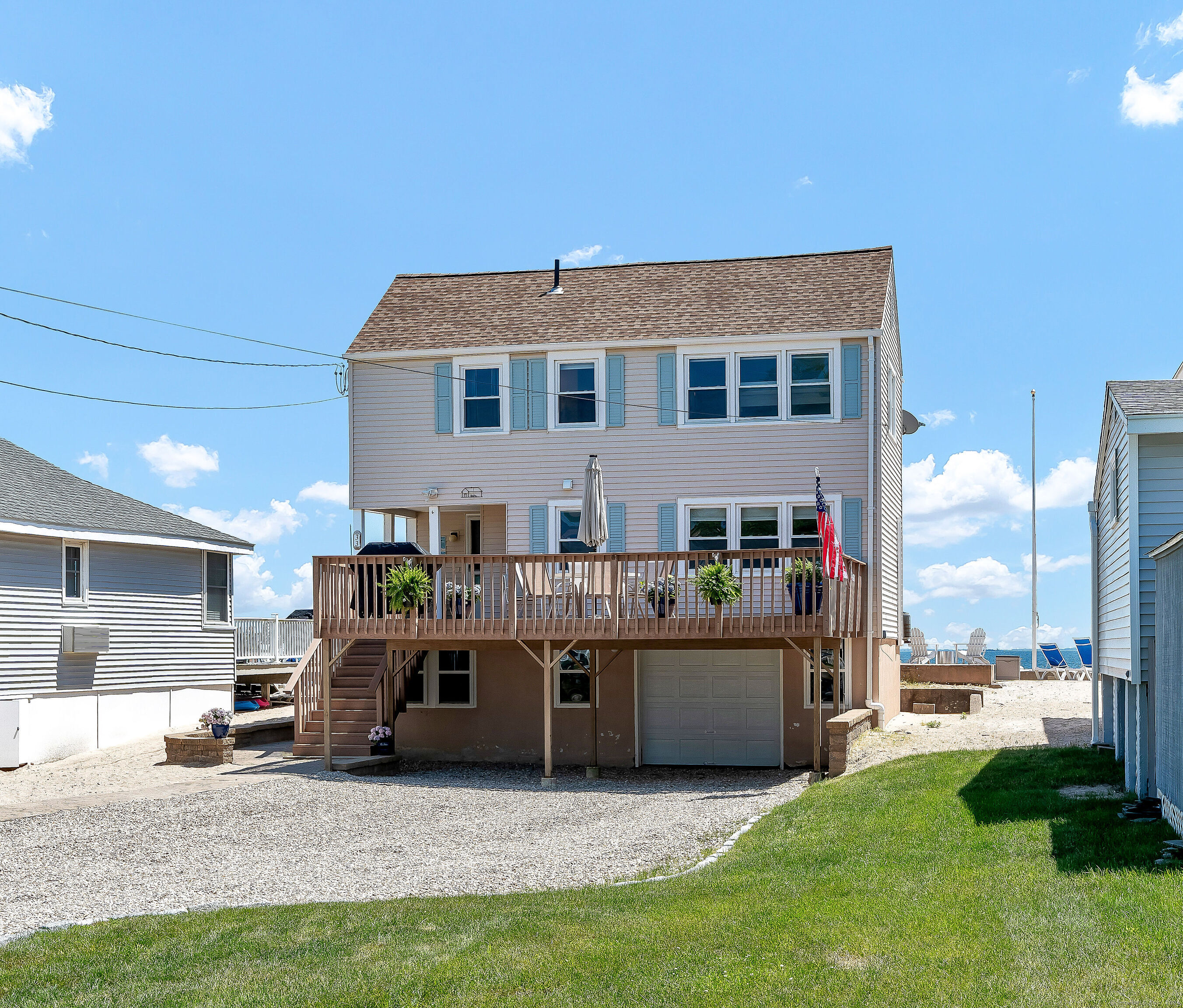 a view of a house with a backyard and a patio