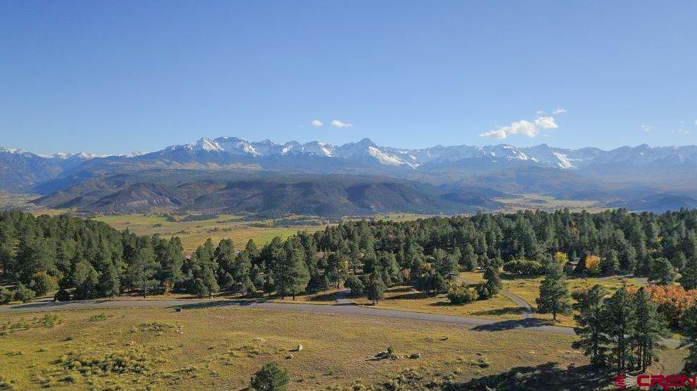 a view of a town with mountains in the background