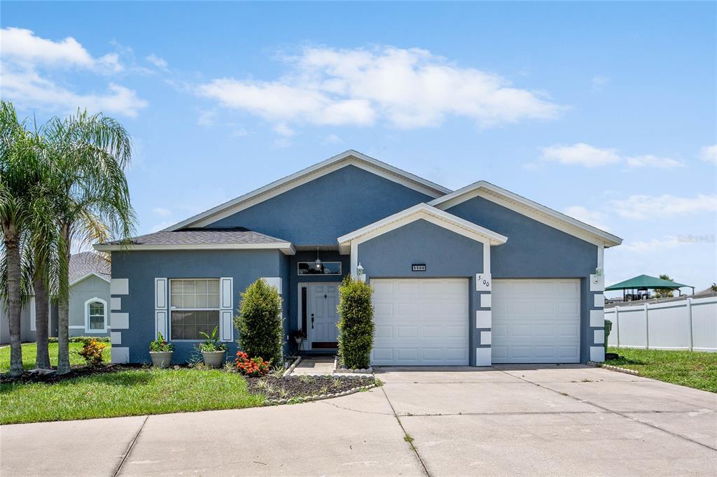 front view of a house with a yard