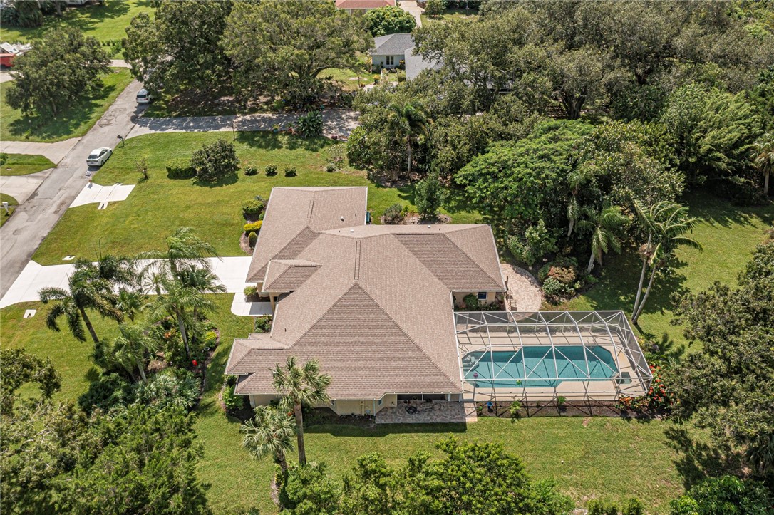 an aerial view of a house with a garden