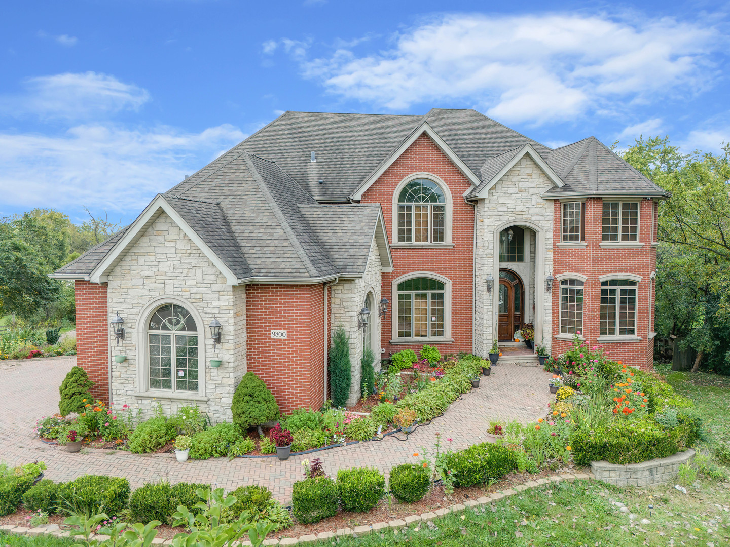 a front view of a house with garden