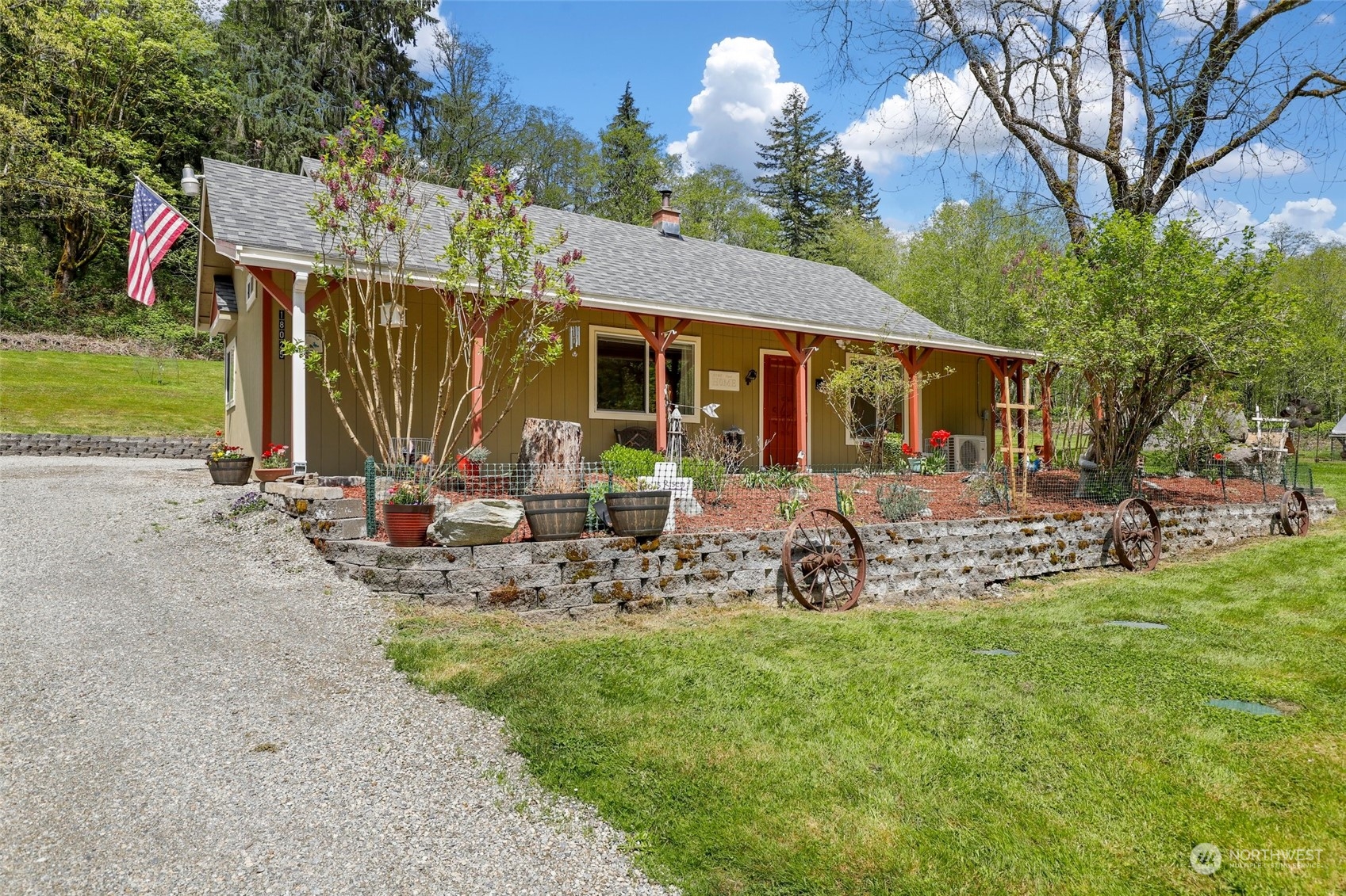 a view of a house with backyard sitting area and garden