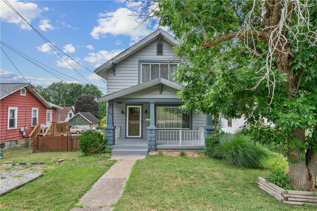 front view of a house with a yard