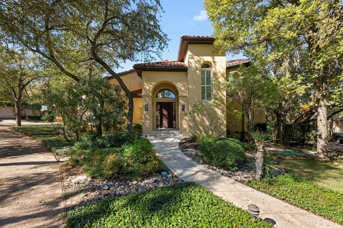 a front view of a house with garden