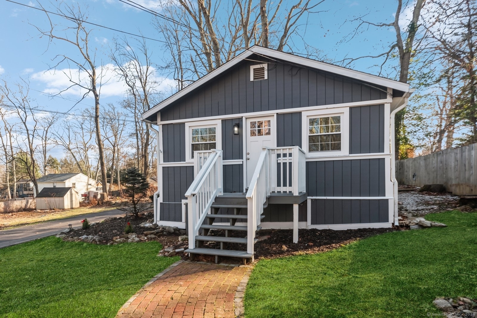 a front view of a house with a yard