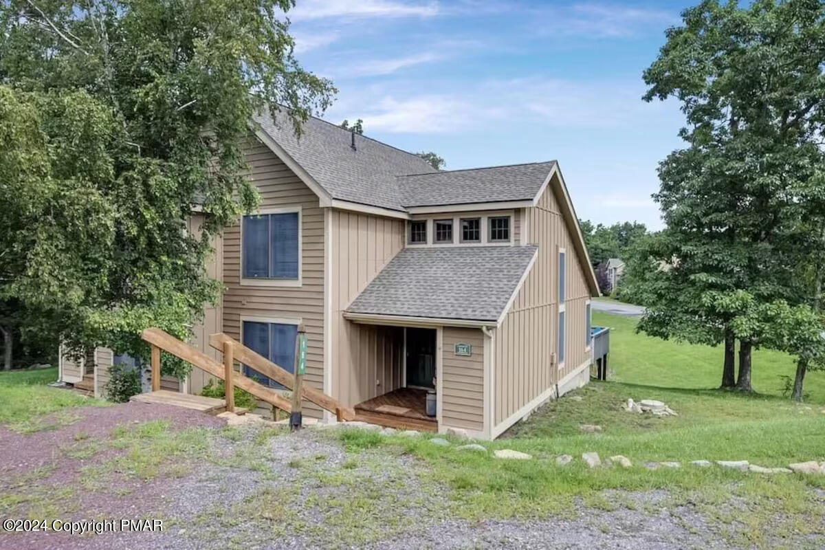 a front view of a house with garden