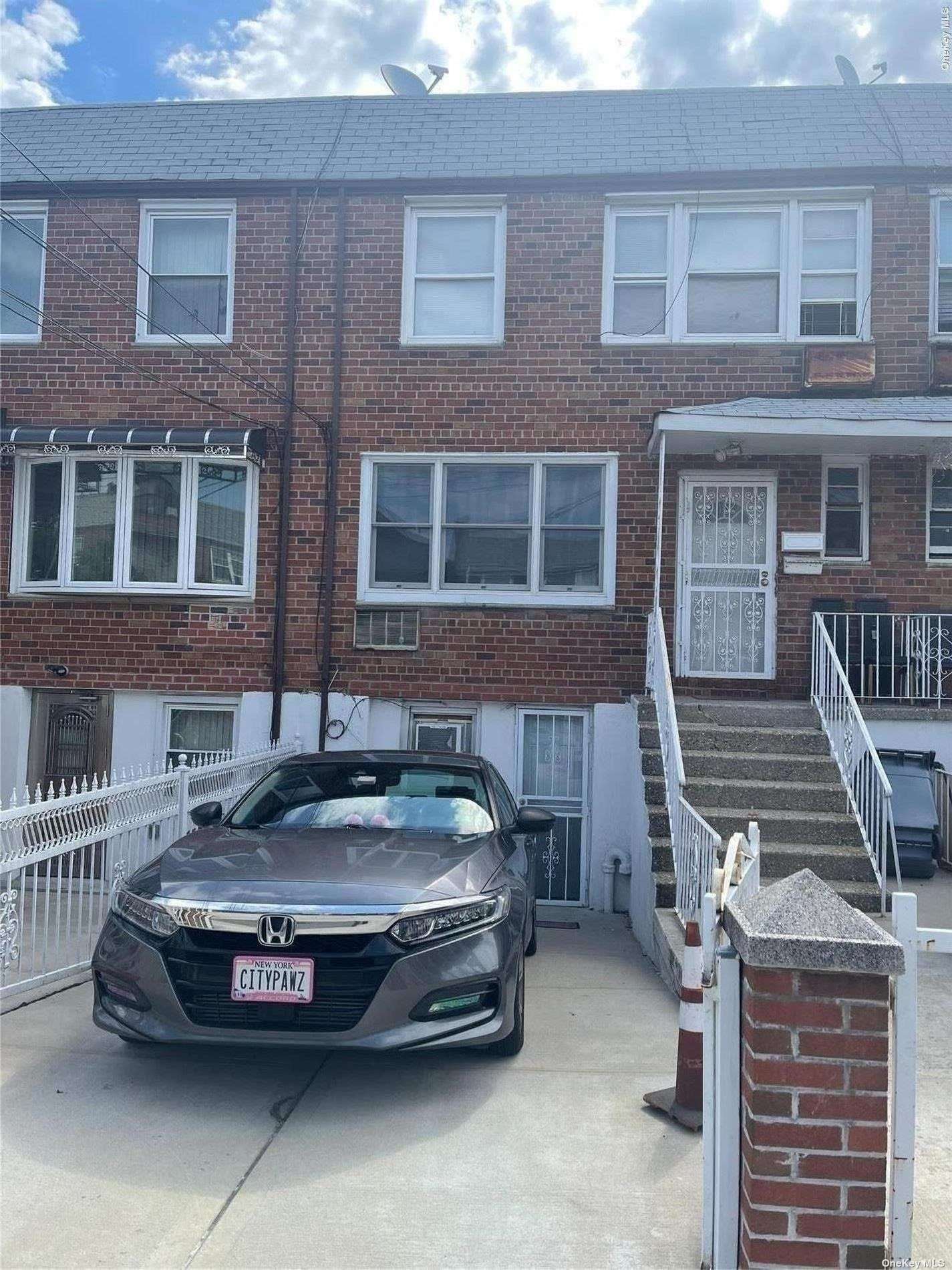 a front view of a house with parking space