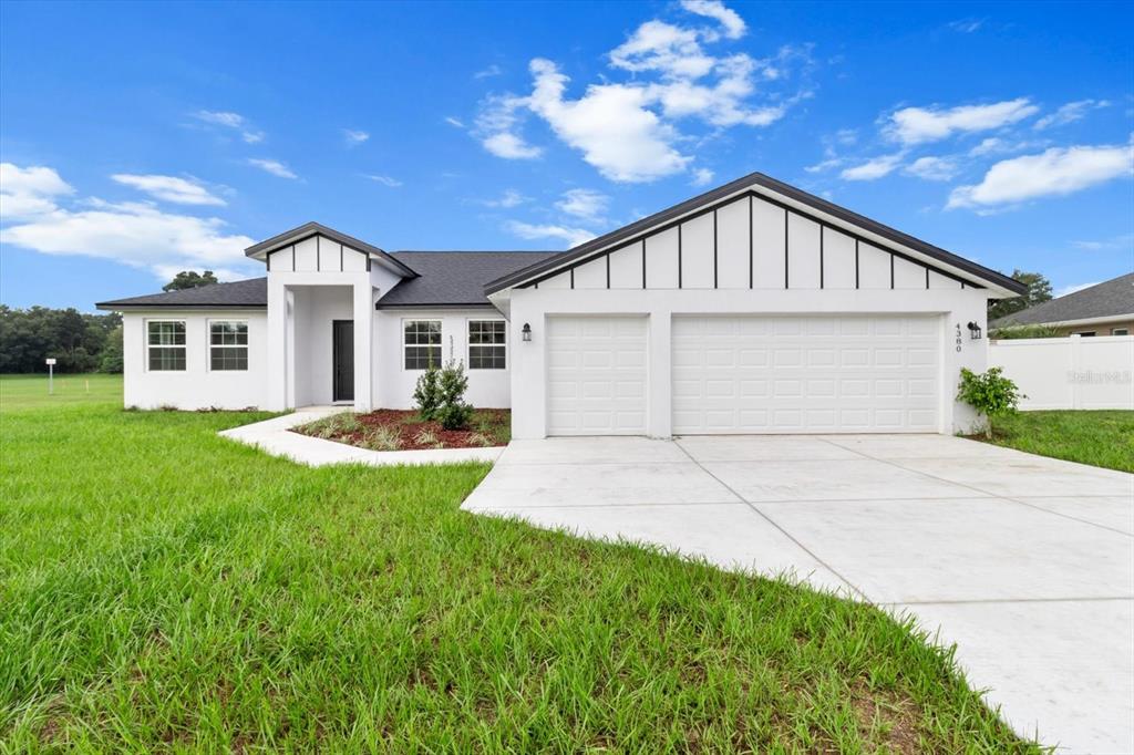 a front view of a house with yard