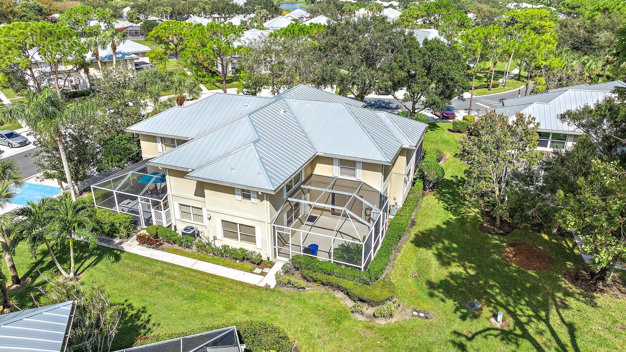 a aerial view of a house with a yard