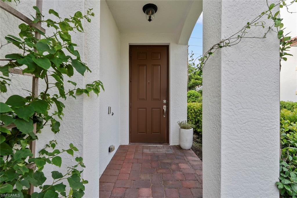 a view of a entryway with flower pots