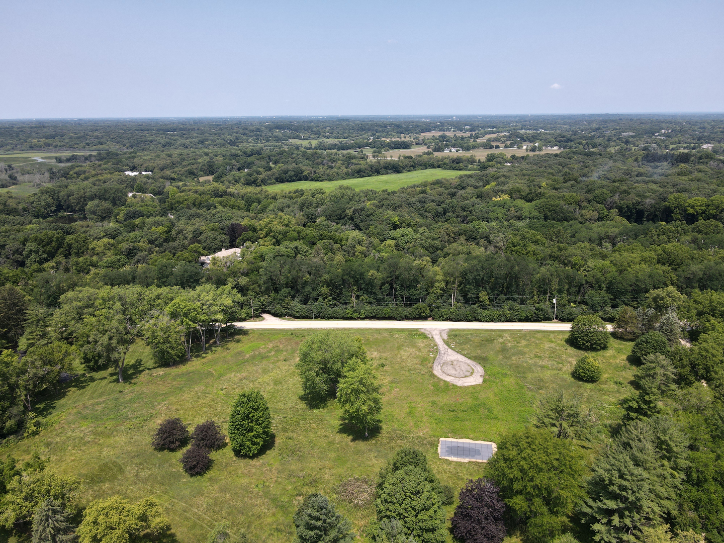 an aerial view of a residential houses with outdoor space