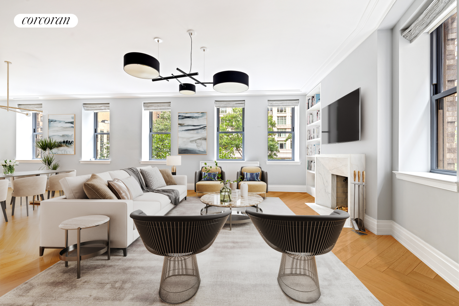 a living room with furniture a fireplace and a large window