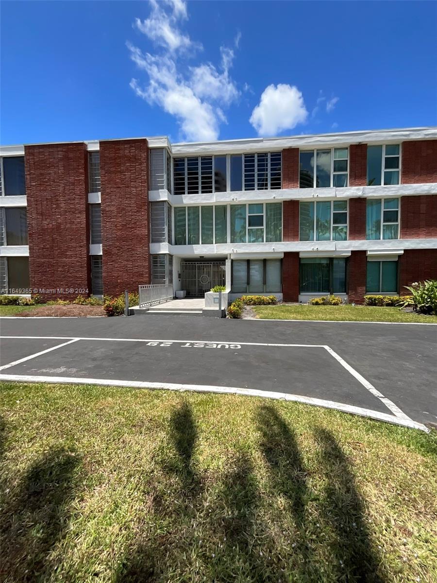 a view of a building with a swimming pool