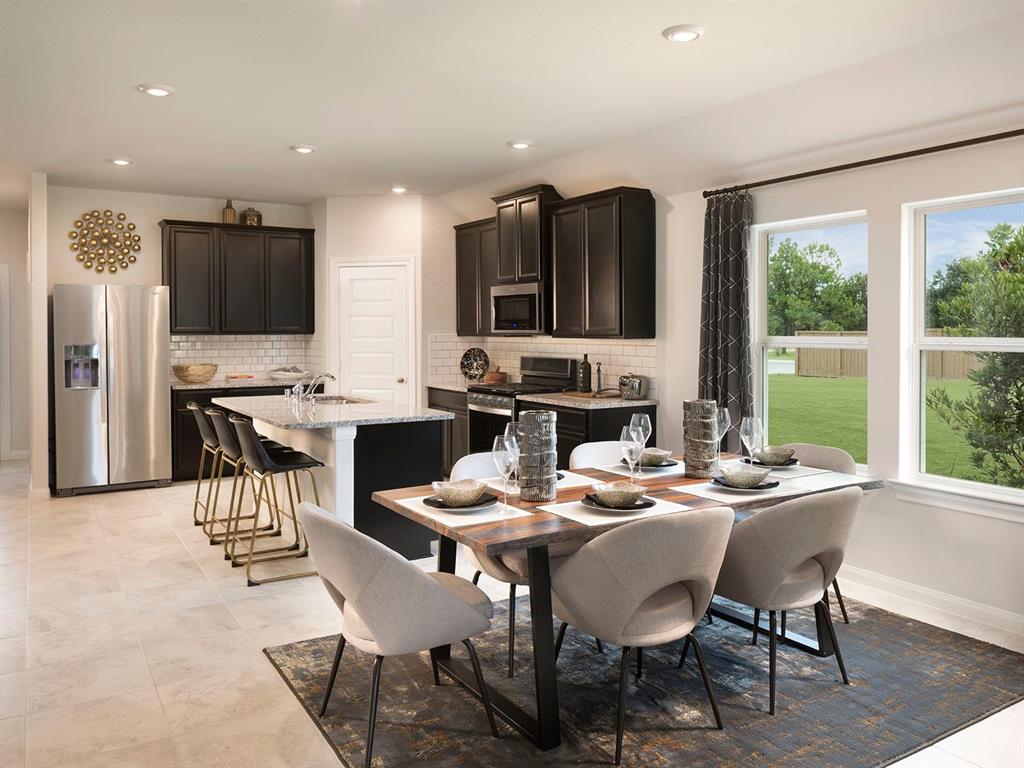 a view of a dining room with furniture