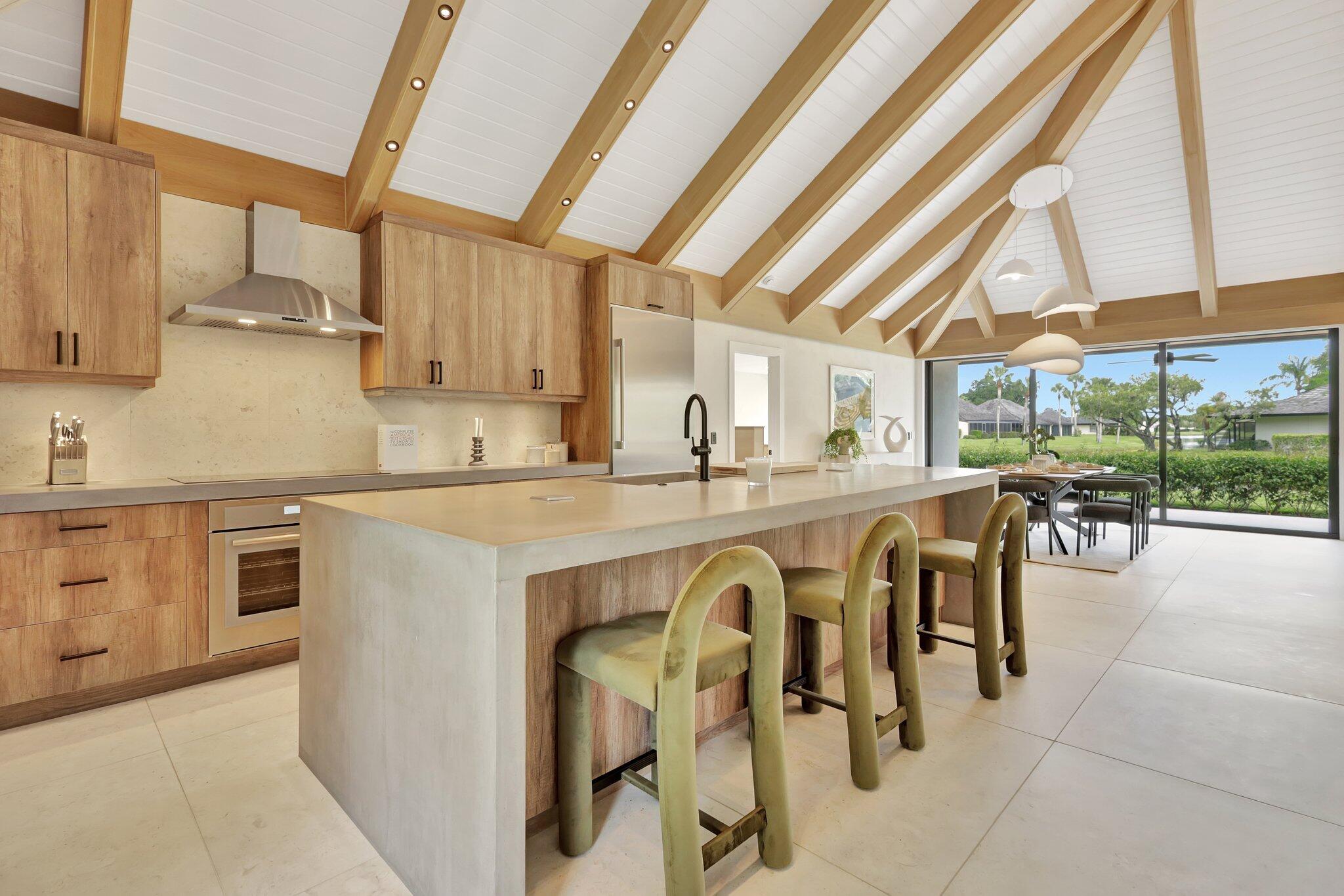 a kitchen with stainless steel appliances granite countertop a sink and cabinets