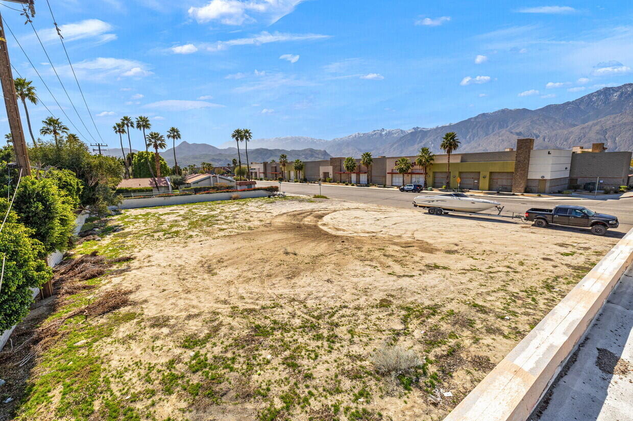 a view of a swimming pool and a yard