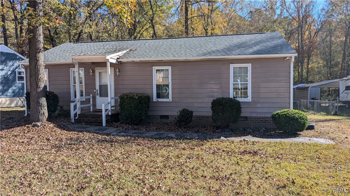 Ranch-style home with a front lawn