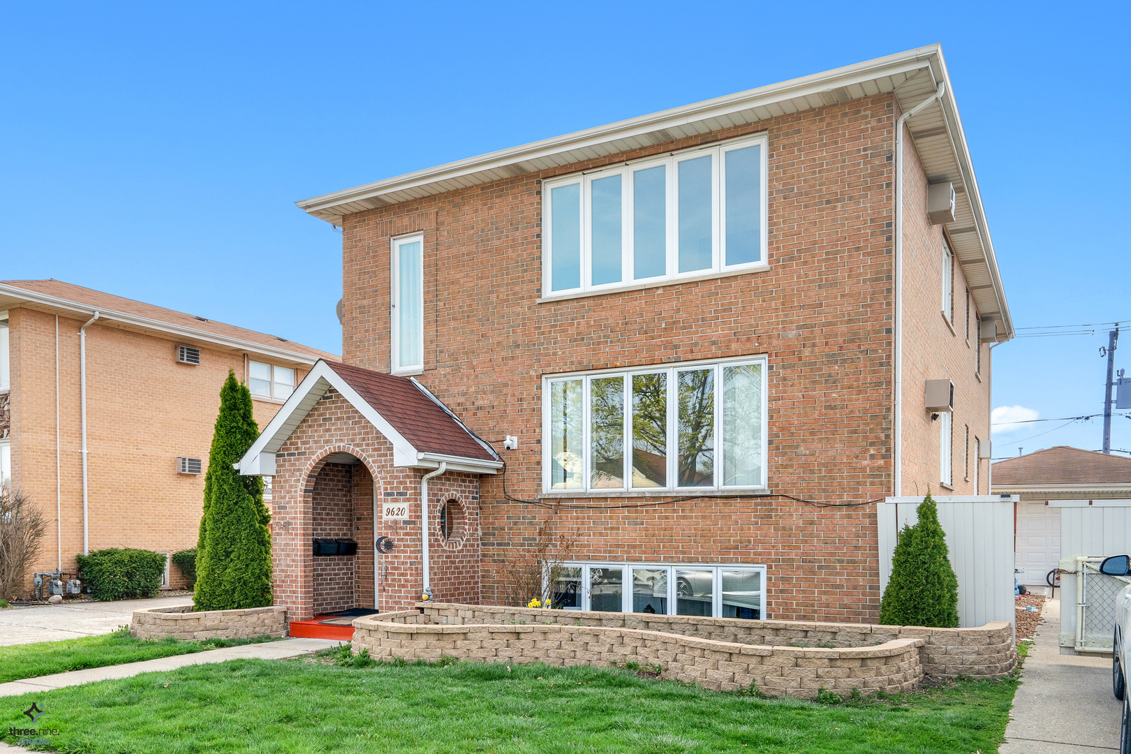 a front view of a house with a yard