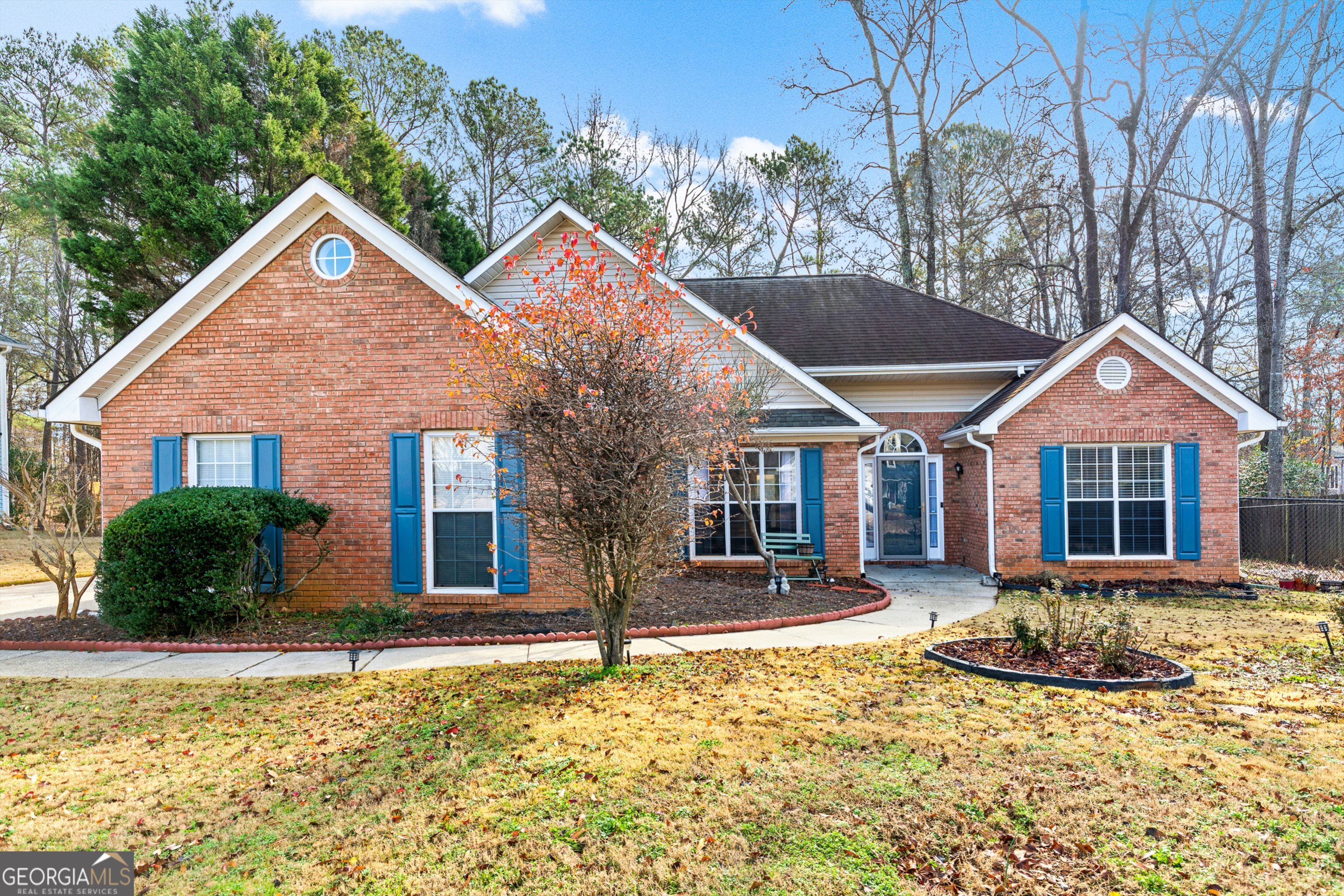 front view of a house with a yard